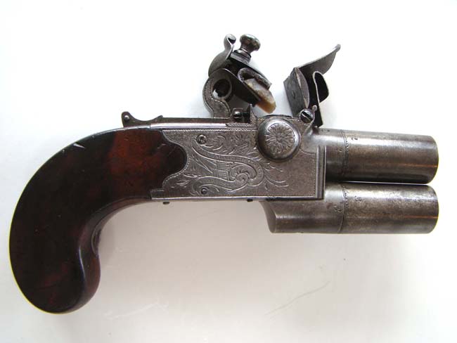 An 18th century double barreled flintlock pocket pistol signed "H.W. Mortimer, Gun Maker to His Majesty" circa 1790.